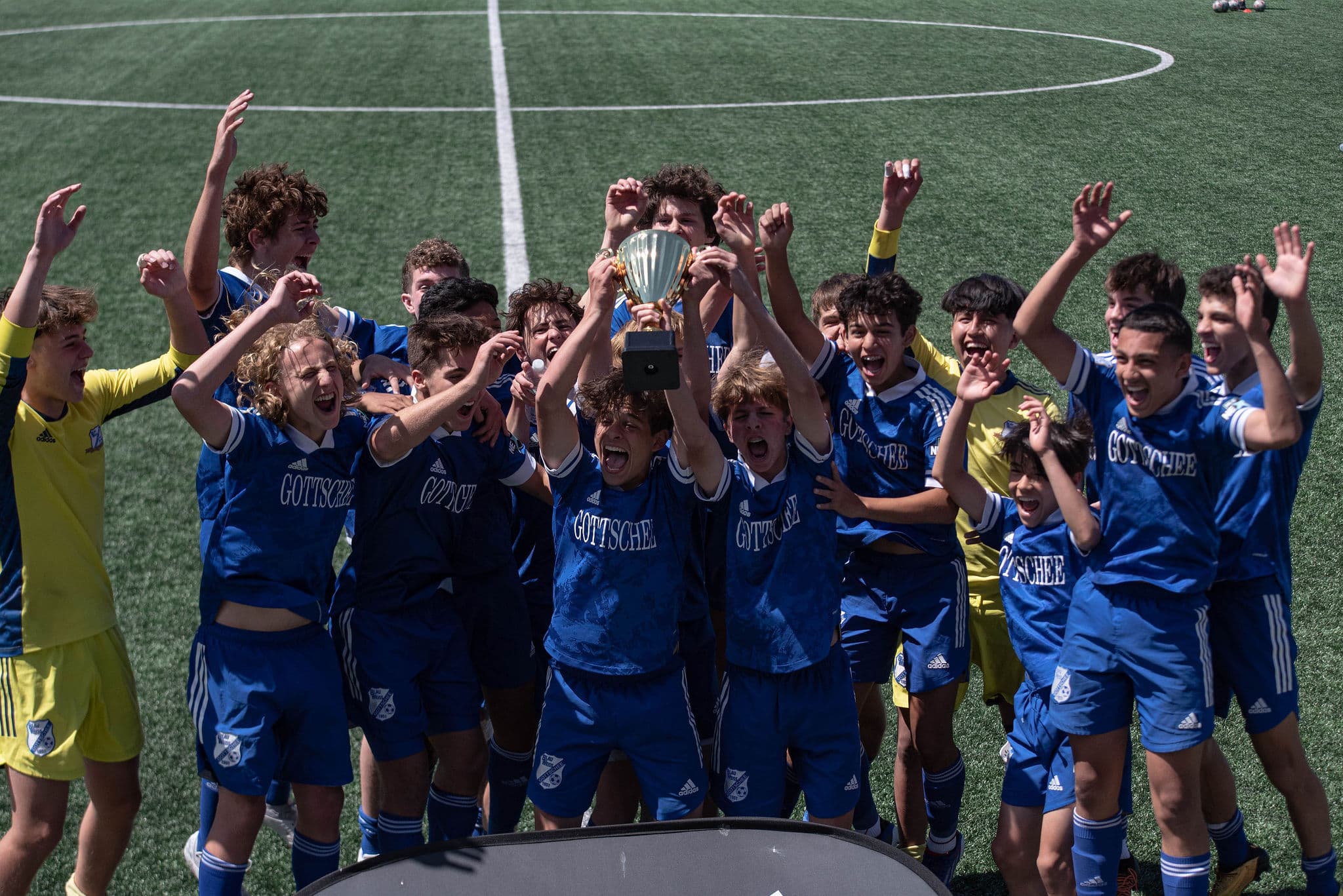 gottschee lifting the Northeast league trophy